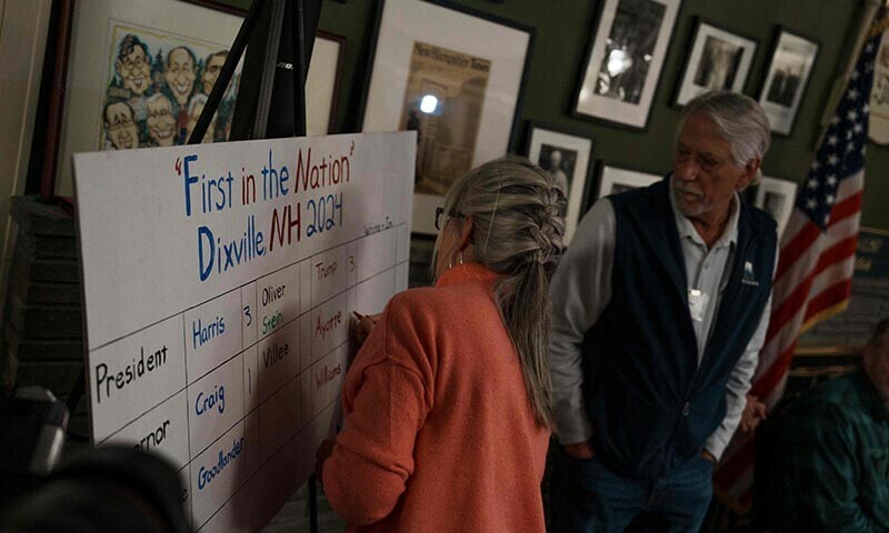 Six registered voters cast their vote on November 5, 2024 in Dixville Notch, New Hampshire &mdash; AFP