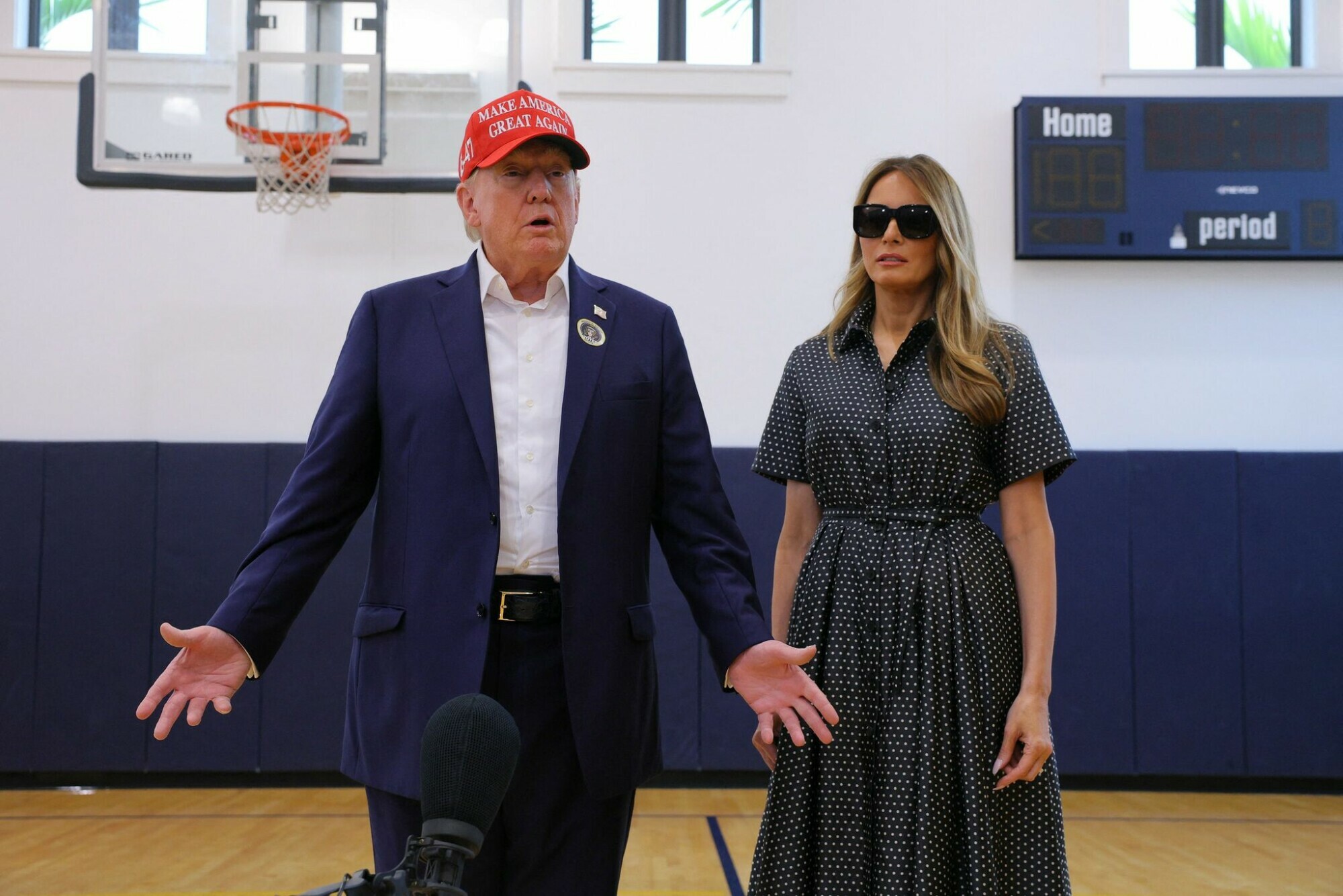 Republican presidential nominee and former US president Donald Trump, flanked by former US first lady Melania Trump, speaks to reporters as he votes at Mandel Recreation Center on Election Day in Palm Beach, Florida, US, November 5, 2024. — Reuters