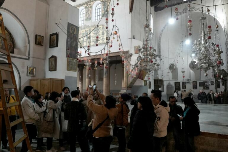 An inside view of the Church of the Nativity, believed to be the birthplace of Jesus Christ, as the preparations for Christmas continue on Tuesday in Bethlehem, occupied West Bank. Due to Israel’s ongoing airstrikes on Gaza, this year’s celebrations will be limited to religious services and prayers, with public festivities kept to a minimum. — Anadolu
