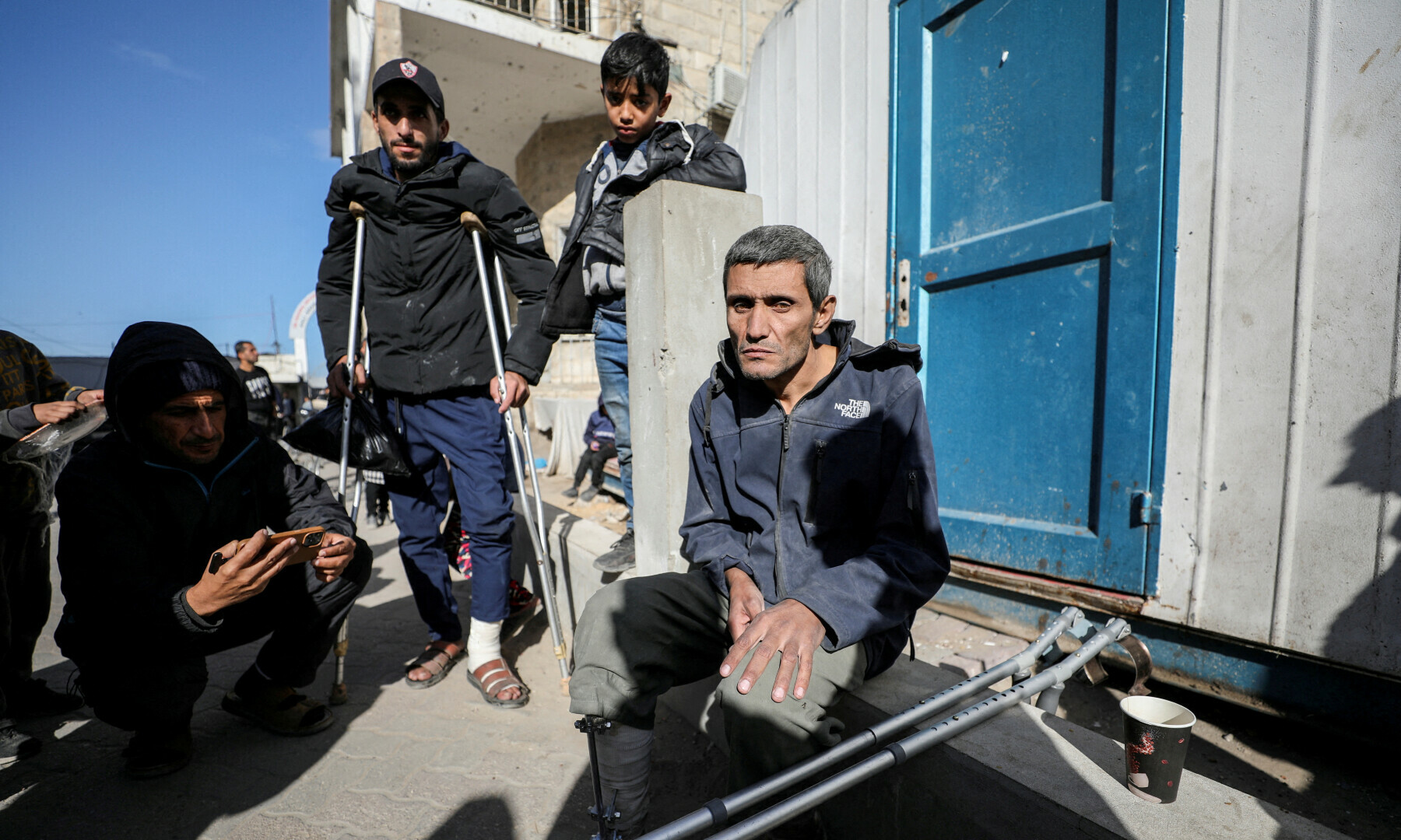 A Palestinian, evacuated from Kamal Adwan hospital in northern Gaza after Israeli forces raided the medical facility, sits next to crutches, in Gaza City, on Dec 28, 2024. — Reuters