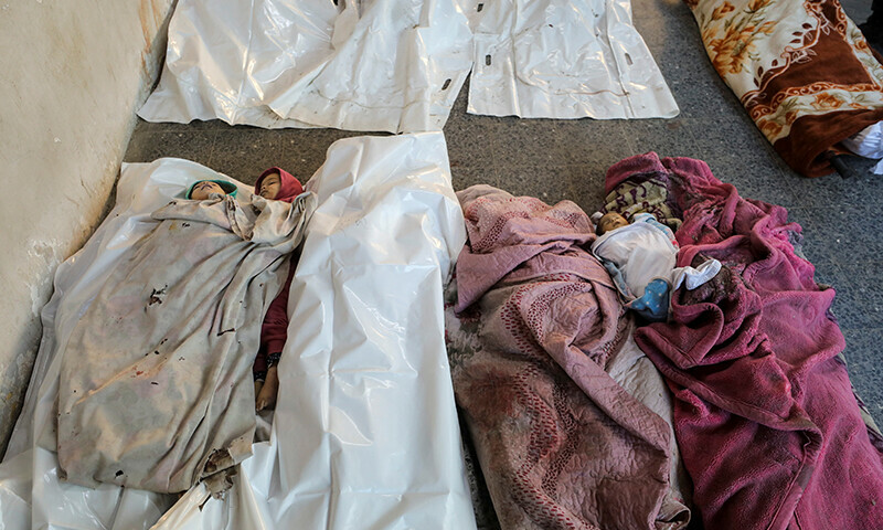 Bodies of Palestinian children killed in Israeli strikes, according to medics, lie on the floor, amid the ongoing conflict between Israel and Hamas, at Al-Ahli Arab Baptist hospital in Gaza City on January 8. &mdash; Reuters