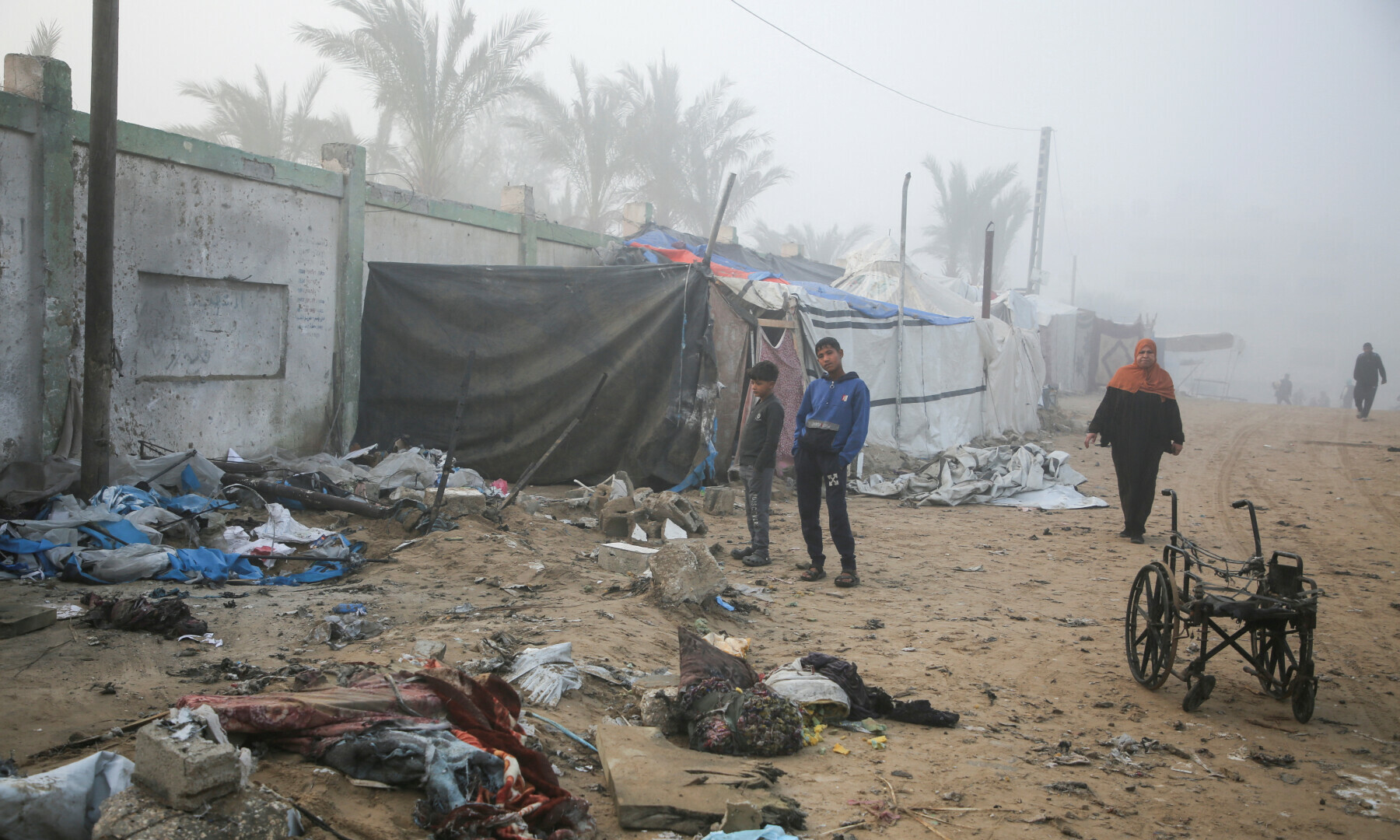 Palestinian boys stand near a damaged tent for displaced people, after an Israeli airstrike in Khan Younis, southern Gaza Strip, on Jan 17, 2025. — Reuters/Hatem Khaled