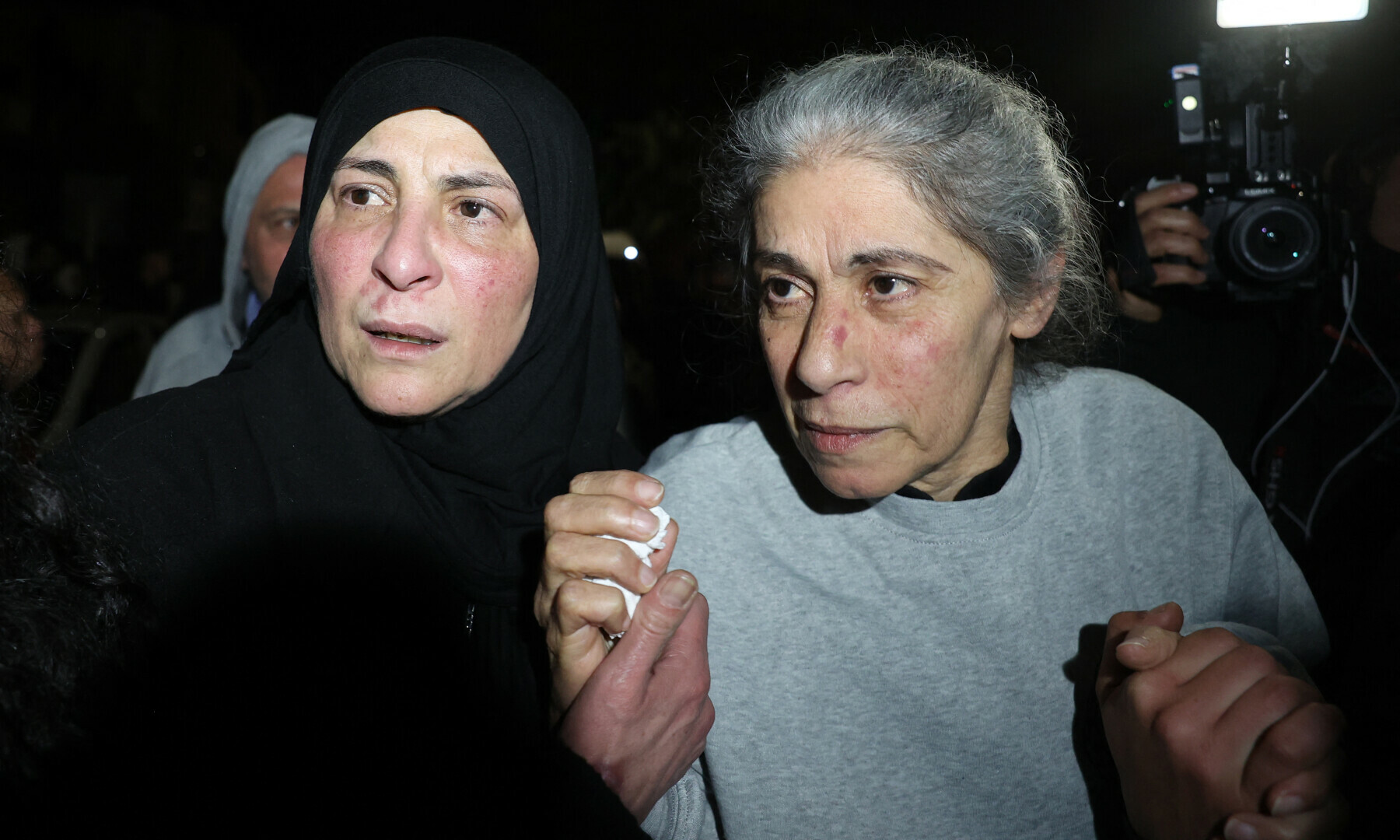  Palestinian prominent prisoner Khalida Jarrar (R), a figure in the Marxist Popular Front for the Liberation of Palestine (PFLP), is greeted by well-wishers following her release from Israeli prison in the early hours of Jan 20, 2025, in the occupied West Bank town of Beitunia, outside Ramallah. &mdash; AFP 