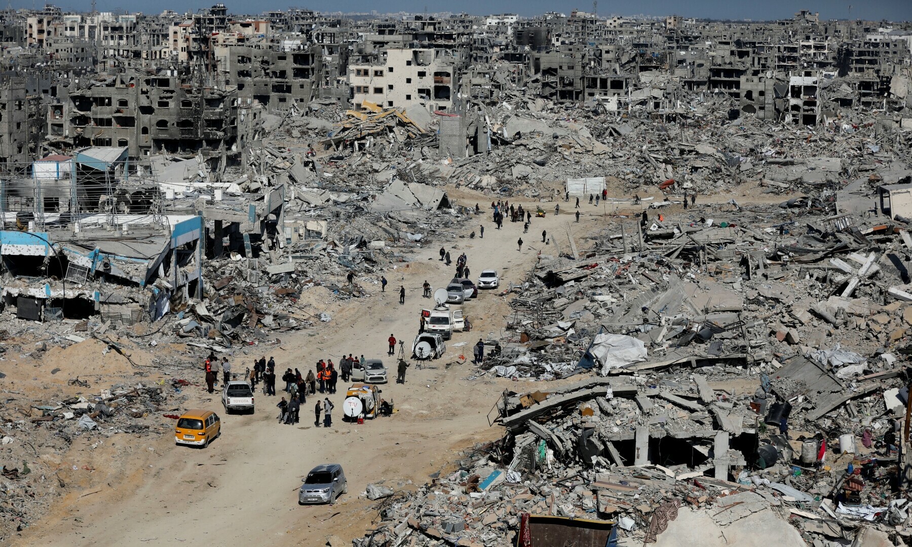 Palestinians walk near the rubble of destroyed houses and buildings, in Jabalia in the northern Gaza Strip on January 21, 2025. —Reuters/Dawoud Abu Alkas