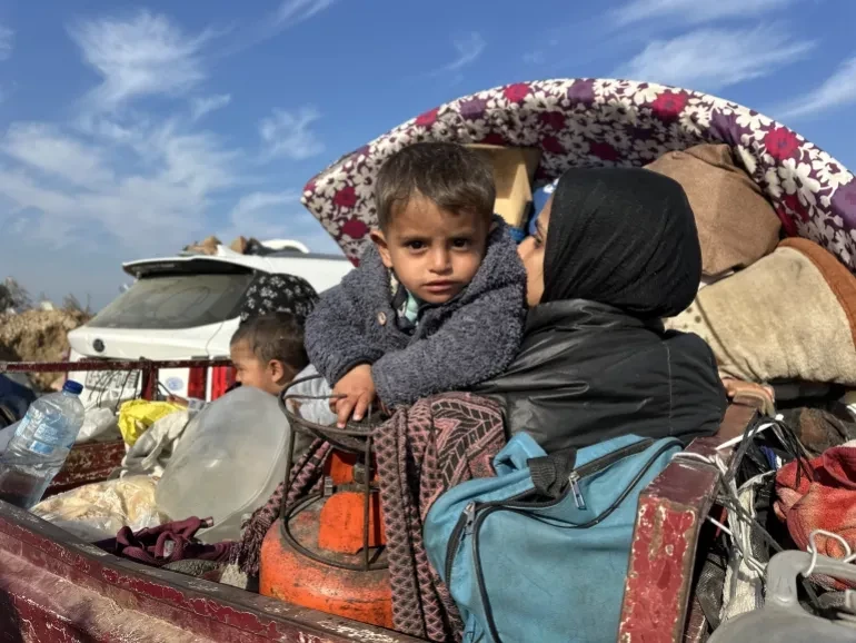 A Palestinian family on their journey back to northern Gaza on January 28. &mdash; Anadolu Agency