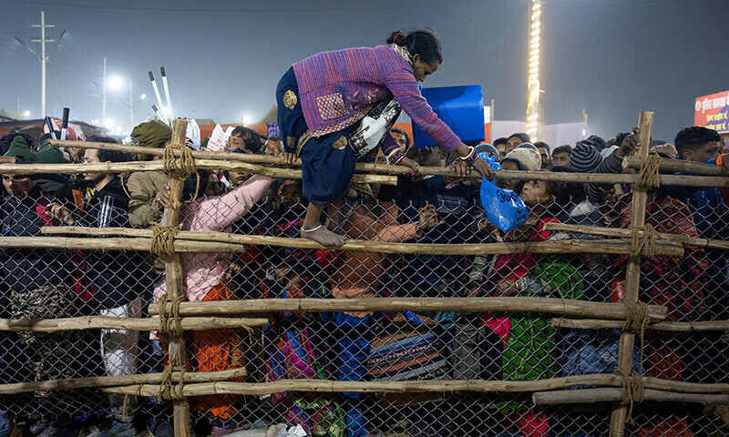 A devotee crosses over a barricade, after a deadly stampede before the second “Shahi Snan” (royal bath), at the “Maha Kumbh Mela” or the Great Pitcher Festival in Prayagraj, India on January 29. — Reuters 