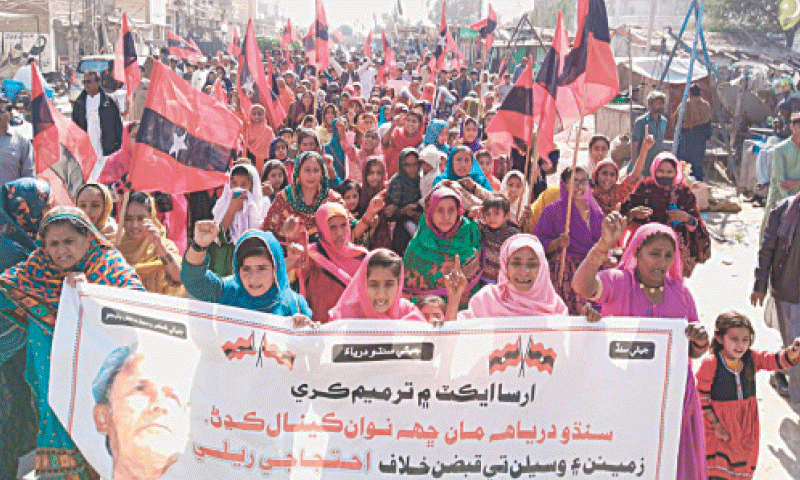 AWAMI Tehreek workers hold a march in Jhuddo town of Mirpurkhas, on Sunday.—Dawn AWAMI Tehreek workers hold a march in Jhuddo town of Mirpurkhas, on Sunday.—Dawn