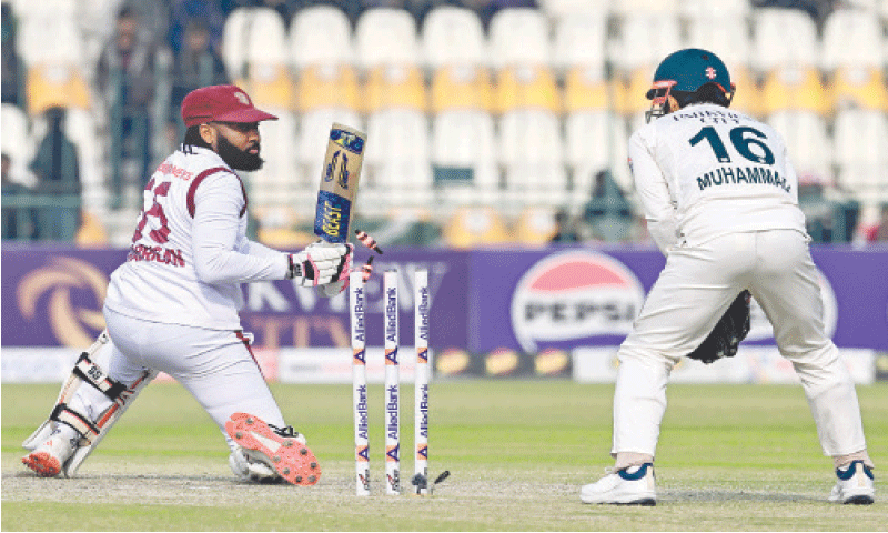 MULTAN: West Indies tailender Jomel Warrican is cleaned up by Pakistan spinner Abrar Ahmed during the first Test at the Multan Cricket Stadium.&mdash;AFP