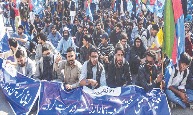 Students stage a sit-in at the Arts Council roundabout, on Thursday.&mdash;Fahim Siddiqi / White Star