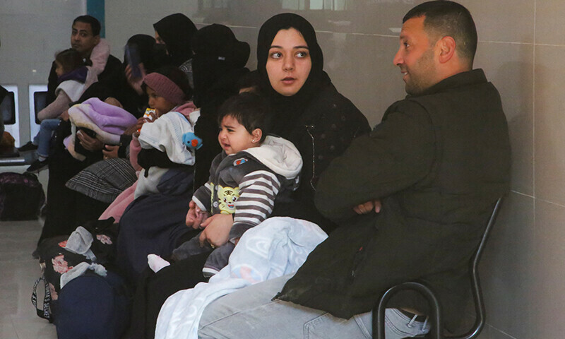 A Palestinian woman holds a sick child before leaving Gaza for treatment abroad through Rafah crossing, in Khan Younis in the southern Gaza Strip, February 1. &mdash; Reuters