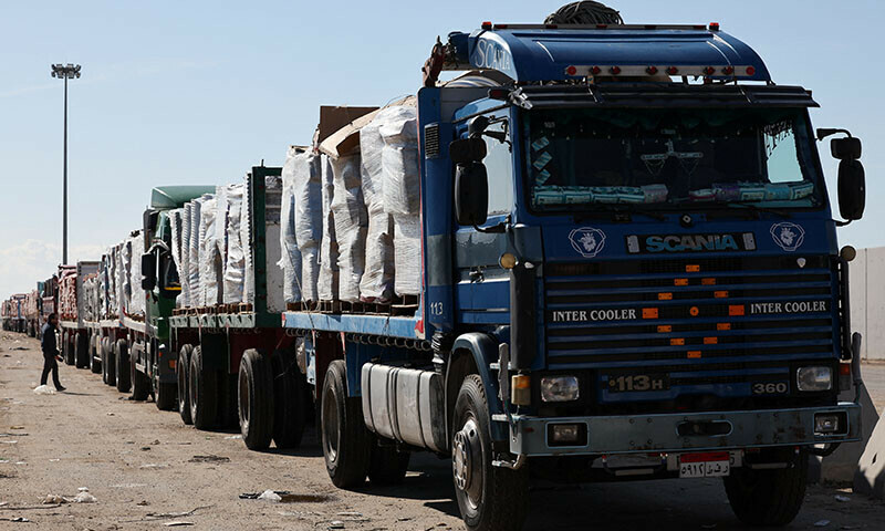  Trucks carrying aid line up near the Rafah border crossing between Egypt and the Gaza Strip on February 1. &mdash; Reuters 