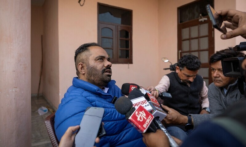  Daler Singh, 37, who was among 104 Indians deported by US authorities on Wednesday, talks to the media at his house in the village of Salempura, Amritsar, India, February 6. — Reuters