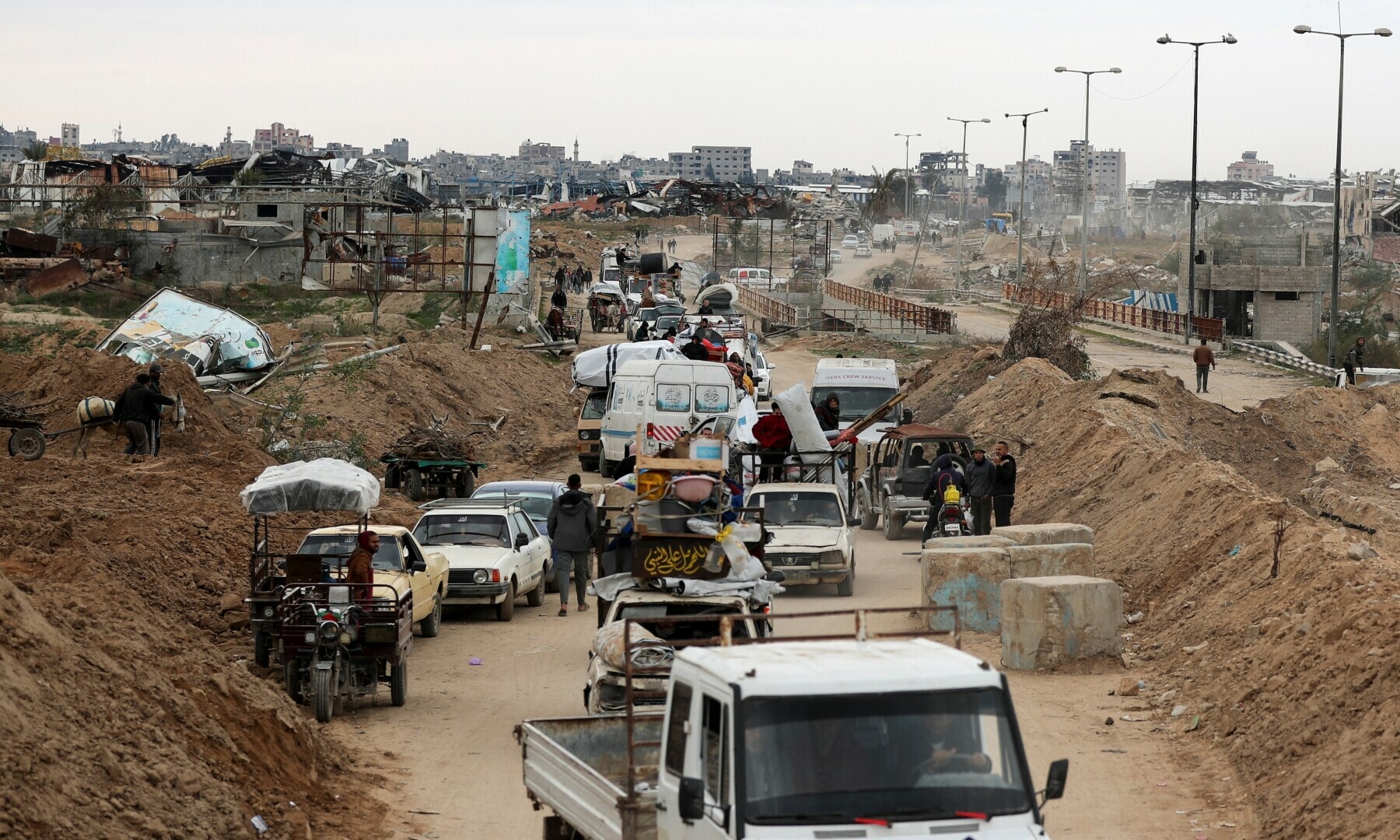Palestinians make their way after Israeli forces withdrew from the Netzarim Corridor, allowing people to travel in both directions between southern and northern Gaza, amid a ceasefire between Israel and Hamas, near Gaza City on Feb 9, 2025. — Reuters/Dawoud Abu Alkas