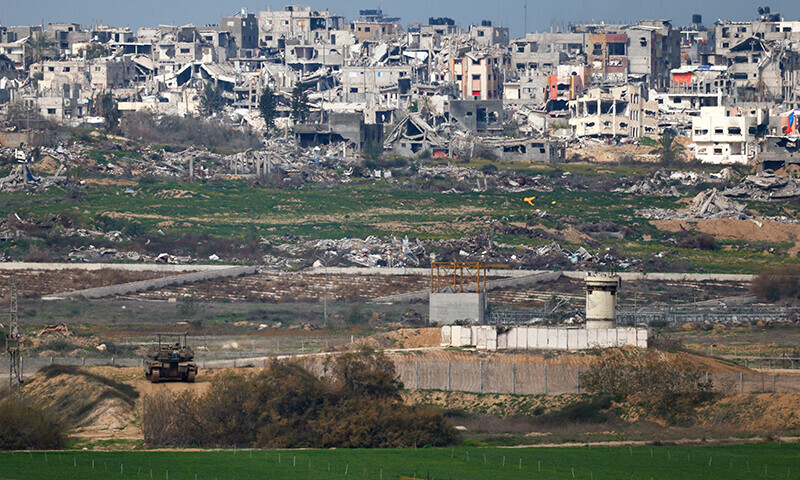 An Israeli military vehicle stands at its position, on the Israeli side of the border with Gaza, amid a ceasefire between Israel and Hamas, in Israel on February 9. — Reuters