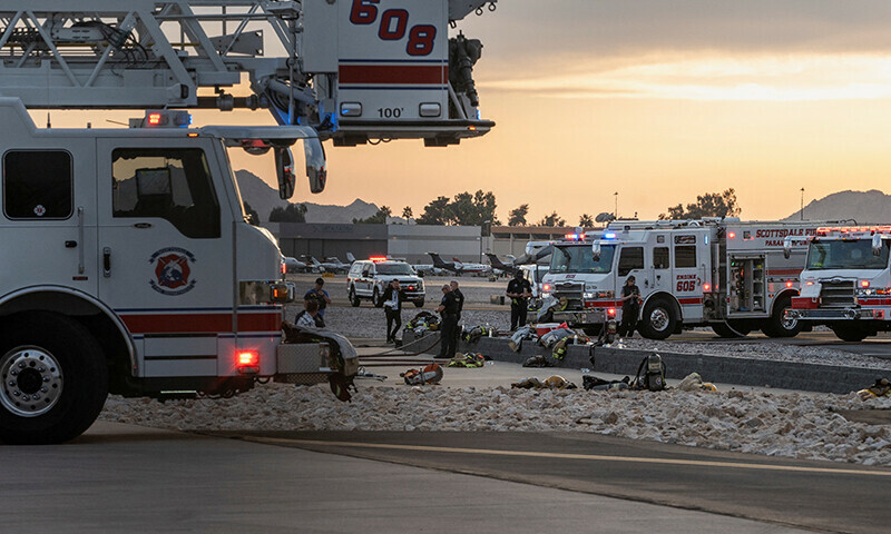 Emergency crews respond after a midsize business jet skidded off the runway while landing and collided with another jet that was parked at the municipal airport in Scottsdale, Arizona, US on February 10. — Reuters