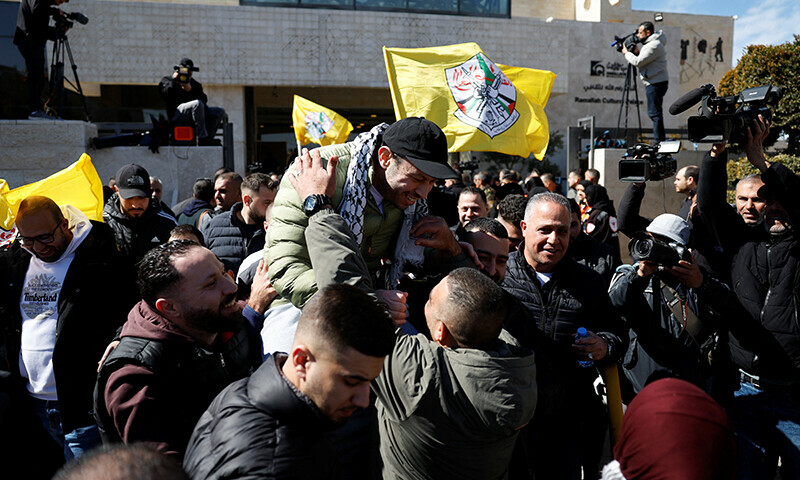 A freed Palestinian detainee is greeted after being released from an Israeli jail as part of a hostages-detainees swap and a ceasefire deal in Gaza between Hamas and Israel, in Ramallah, in the Israeli-occupied West Bank on February 15. &mdash; Reuters