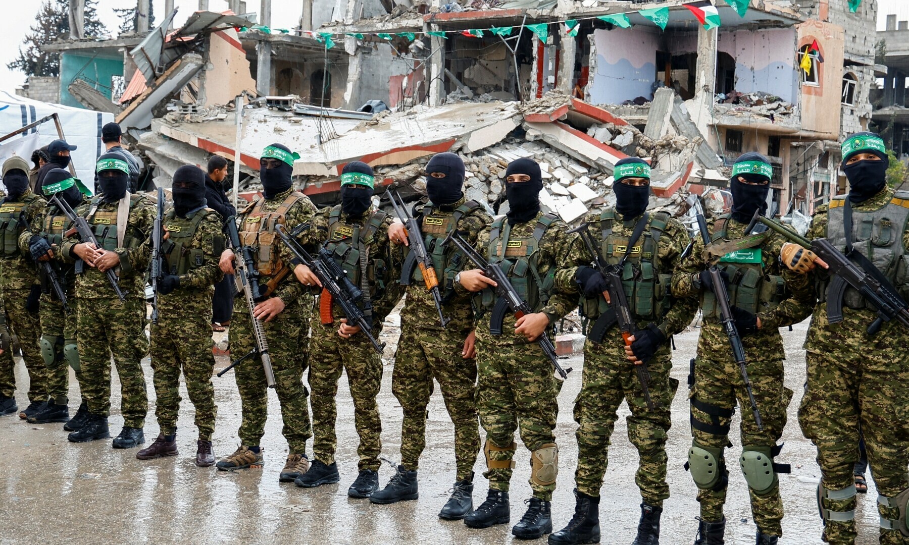 Hamas fighters stand guard on the day of the handover of hostages held in Gaza since Oct 7, 2023 as part of the Gaza ceasefire deal, in Rafah in the southern Gaza Strip on Feb 22, 2025. — Reuters/Hatem Khaled