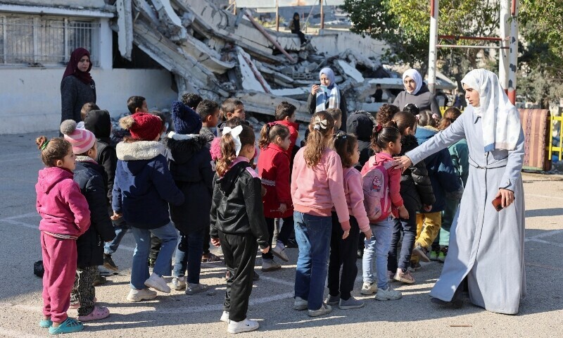 Palestinian children queue at a damaged school, amid a ceasefire between Israel and Hamas, in Gaza City on Feb 25, 2025. — Reuters/Dawoud Abu Alkas