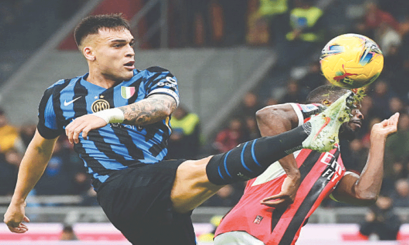 MILAN: Inter Milan’s Lautaro Martinez (L) vies for the ball with AC Milan’s Fikayo Tomori during their Serie A match at the San Siro.—AFP MILAN: Inter Milan’s Lautaro Martinez (L) vies for the ball with AC Milan’s Fikayo Tomori during their Serie A match at the San Siro.—AFP