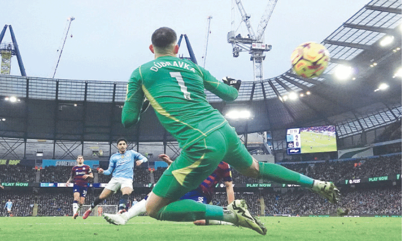 MANCHESTER: Manchester City&rsquo;s Omar Marmoush (second L) scores past Newcastle United goalkeeper Martin Dubravka during their Premier League match at the Etihad Stadium on Saturday.&mdash;Reuters