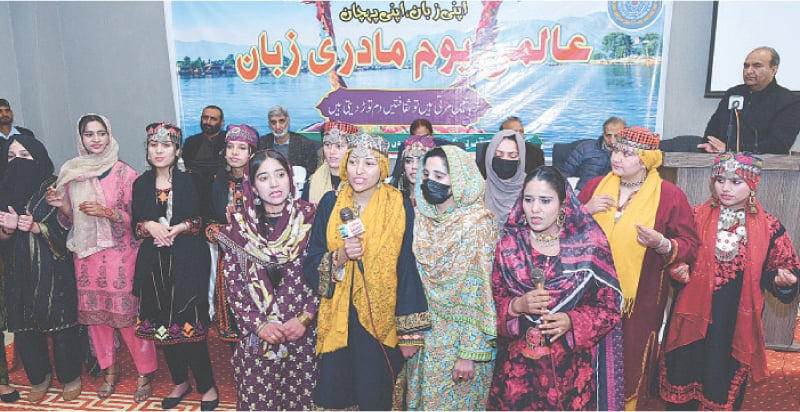 Students of Govt Postgraduate College for Women, Muzaffarabad, present songs at a function held on Friday to mark International Mother Languages Day. &mdash; Dawn