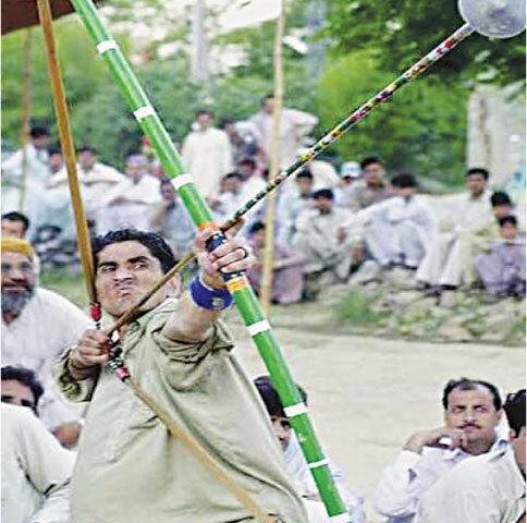 A participant shoots an arrow during a Mukha tournament | Flickr