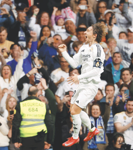 MADRID: Luka Modric of Real Madrid celebrates after scoring during the La Liga match against Girona at the Santiago Bernabeu Stadium.&mdash;AFP