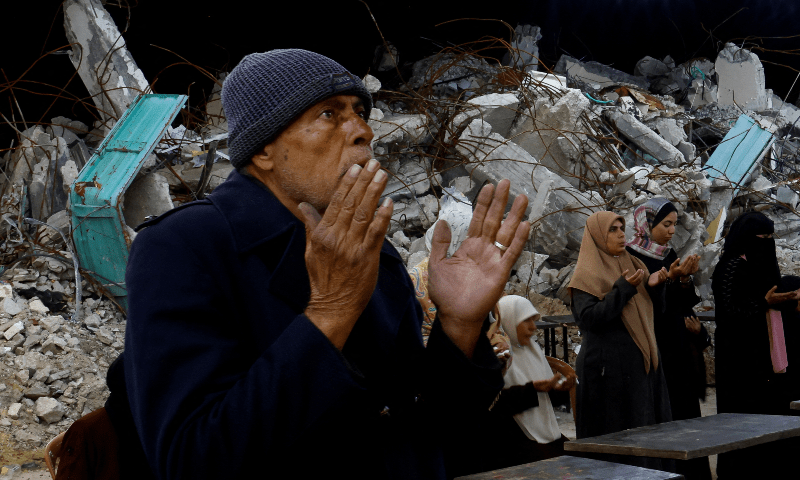 Palestinians perform the mass prayer of Tarawih during the holy month of Ramazan, near the rubble of buildings in Rafah, in the southern Gaza Strip on March 1, 2025. — Reuters/Hatem Khaled
