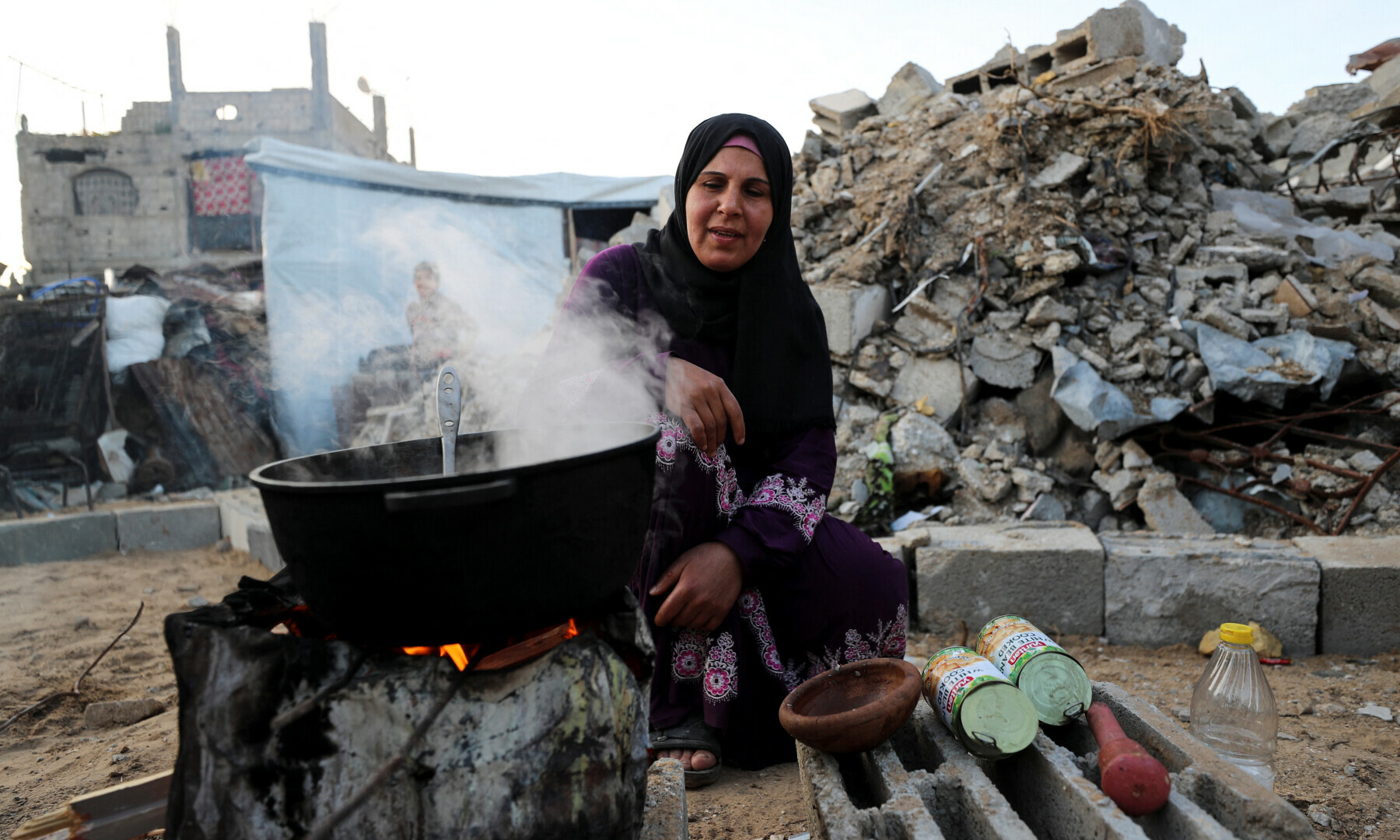 A Palestinian woman prepares Iftar meals to break the fast, during the holy month of Ramadan, at Jabalia refugee camp in northern Gaza Strip on March 2, 2025. — Reuters