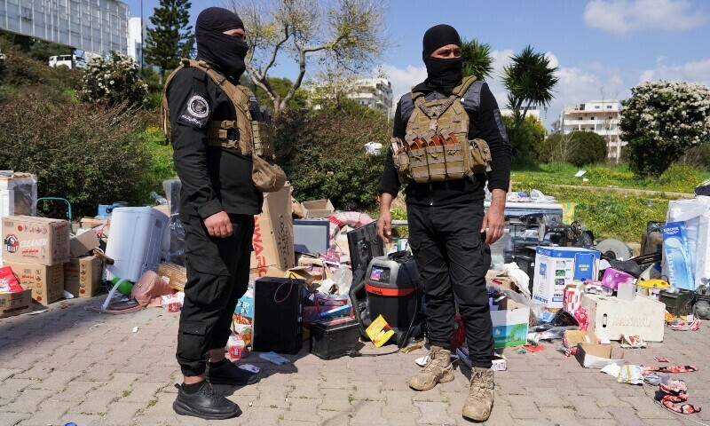 Members of Syrian security forces stand near belongings, after hundreds were killed in some of the deadliest violence in 13 years of civil war, pitting loyalists of deposed President Bashar al-Assad against the country&rsquo;s new Islamist rulers, in Latakia, Syria on March 10. &mdash; Reuters