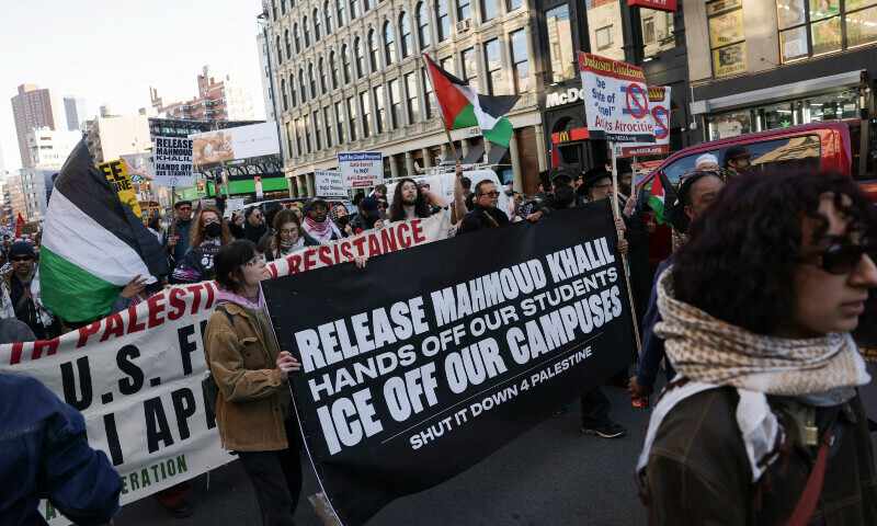 Demonstrators hold banners as they march during a protest following the arrest by US immigration agents of Palestinian student protester Mahmoud Khalil at Columbia University, in New York City, US on March 10. &mdash; Reuters