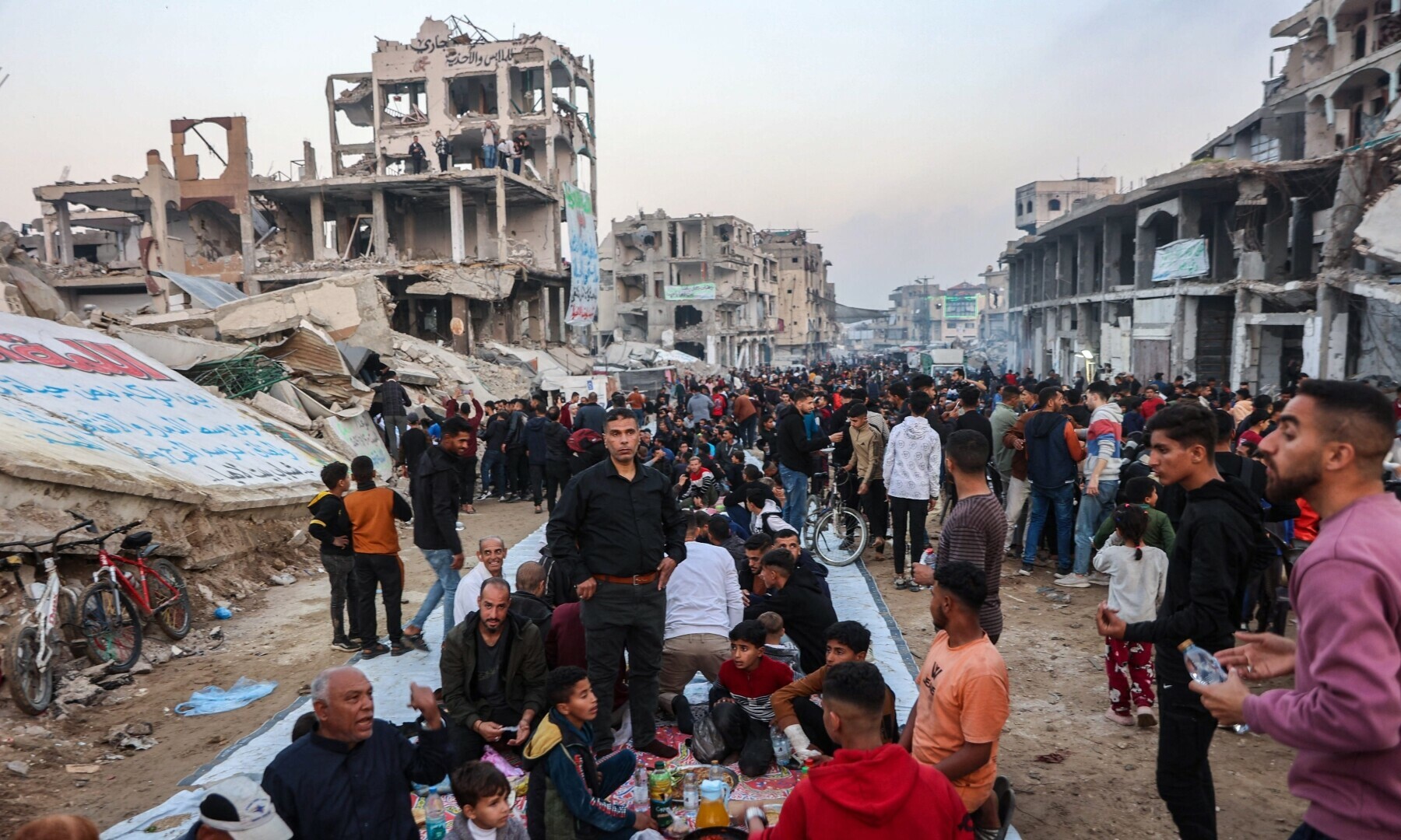 Palestinians gather for a mass Iftar meal amid the rubble of destroyed buildings in Beit Lahia in the northern Gaza Strip on March 15, 2025. — AFP