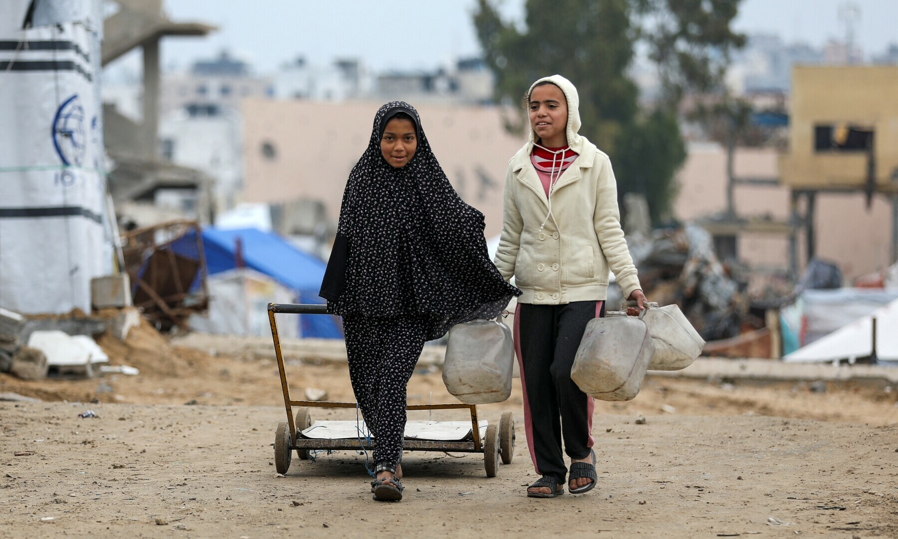 Palestinian girls walk to collect water, amid a ceasefire between Israel and Hamas, in Gaza City on Feb 22, 2025. — Reuters/Dawoud Abu Alkas