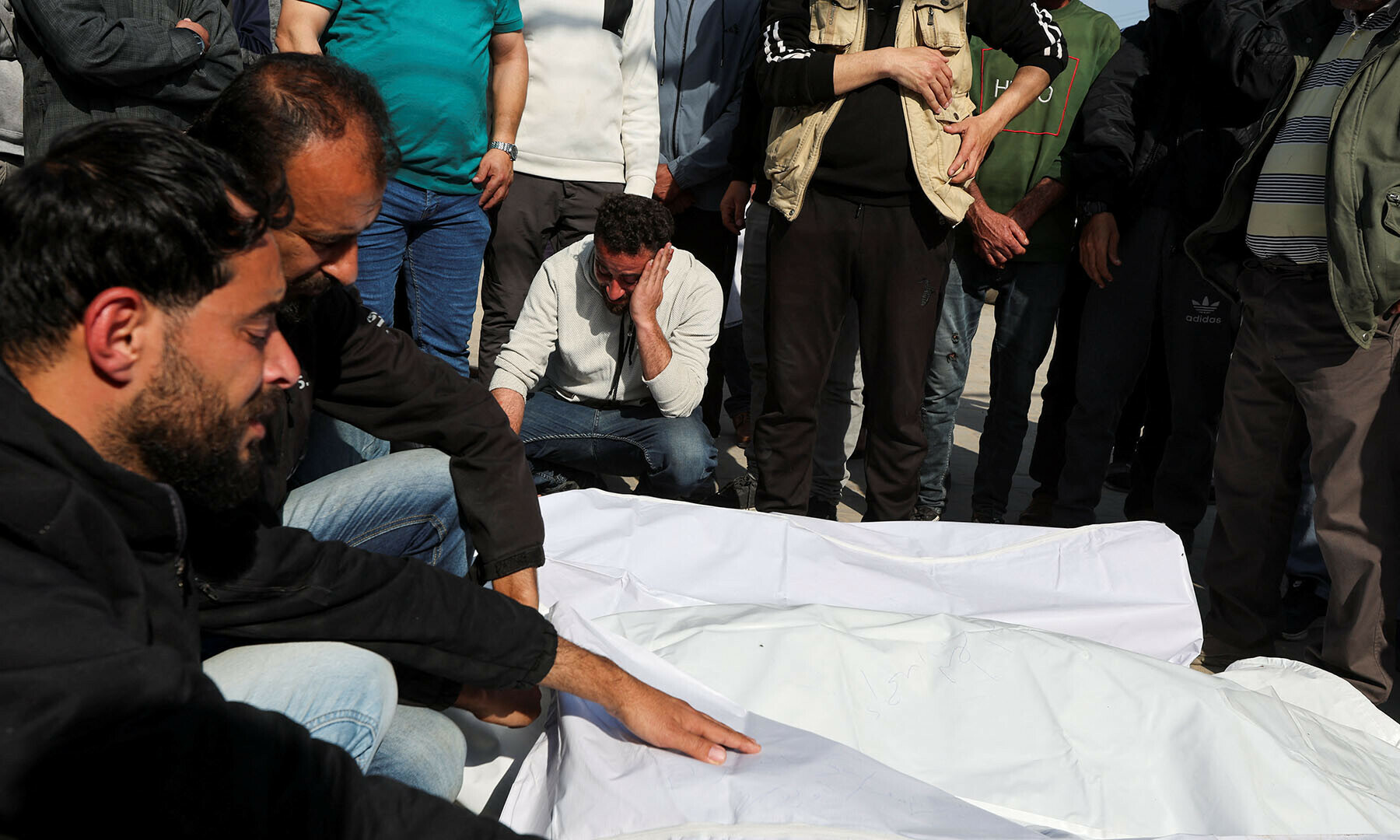Mourners react next to the bodies of Palestinians killed in Israeli strikes, at Al-Aqsa Martyrs hospital, in Deir Al-Balah in the central Gaza Strip on March 18. — Reuters