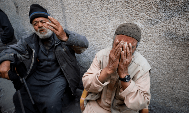 Palestinians react at the site of an Israeli strike on a residential building in Jabalia in the northern Gaza Strip on March 18, 2025. — Reuters/Mahmoud Issa