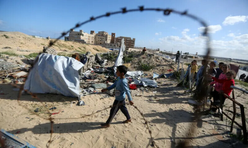 Palestinian children at the site of an Israeli strike on a tent housing displaced people, in Khan Younis, in the southern Gaza Strip on March 19. &mdash; Reuters