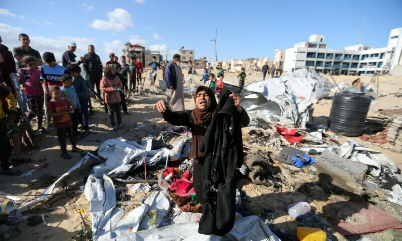 Palestinians inspect the site of an Israeli strike on a tent housing displaced people, in Khan Younis, in the southern Gaza Strip on March 19. &mdash; Reuters