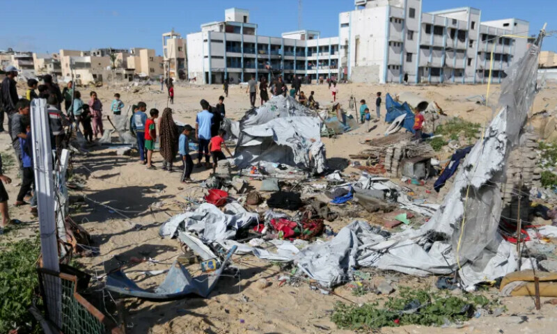 Palestinians inspect the site of an Israeli strike on a tent housing displaced people, in Khan Younis, in the southern Gaza Strip on March 19. &mdash; Reuters