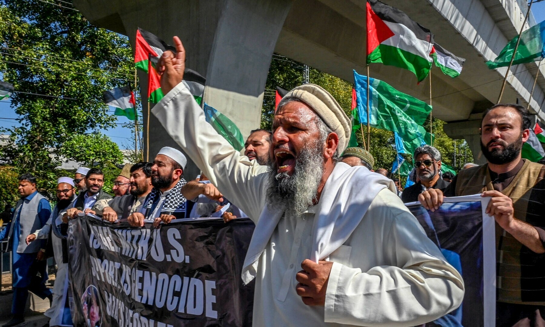 Members and activists of the Jamaat-i-Islami (JI) party shout slogans during a protest to express their solidarity with the Palestinians, in Peshawar on March 21, 2025. — AFP