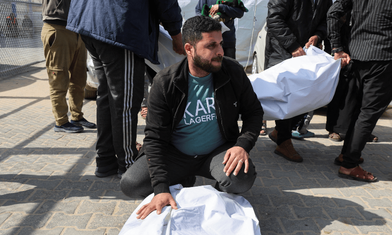  A mourner reacts next to the bodies of Palestinians killed in Israeli strikes, at Al-Aqsa Martyrs hospital, in Deir Al-Balah in the central Gaza Strip, on March 25, 2025. &mdash; Reuters/Ramadan Abed 
