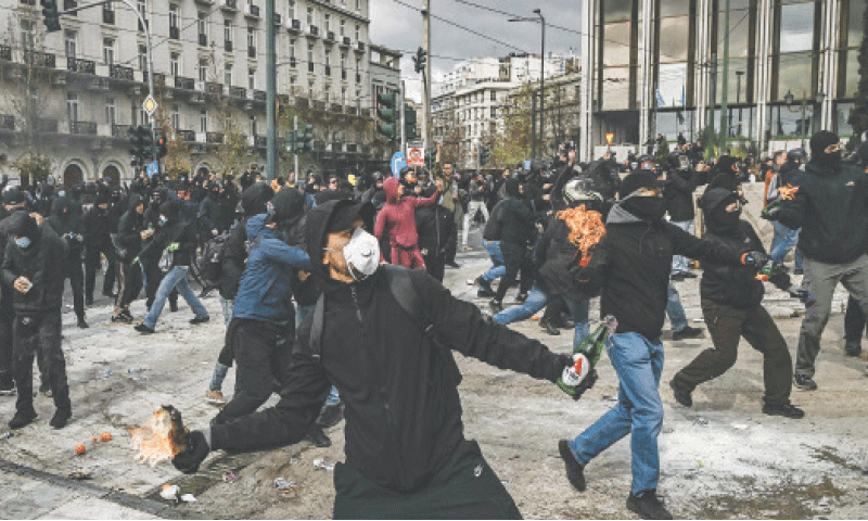 PROTESTERS lob molotov cocktails towards riot police after clashes broke out in Athens during a rally called by unions to mark the second anniversary of Greece&rsquo;s worst rail tragedy on Feb 28, 2023.&mdash;AFP