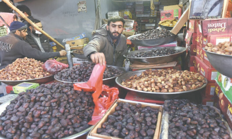 A vendor sells a variety of dates at his shop in Islamabad&rsquo;s fruit and vegetable market on Saturday. &mdash; Photo by Tanveer Shahzad