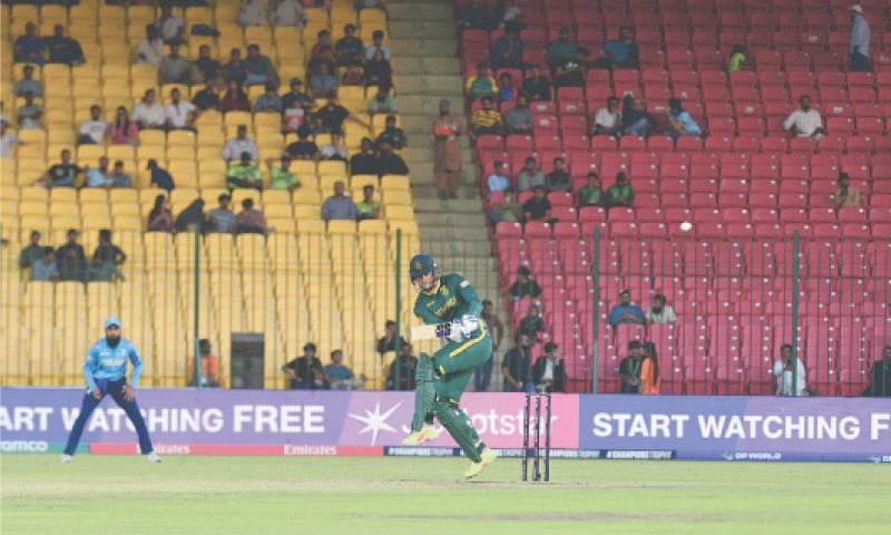 KARACHI: South African batter Rassie van der Dussen plays a stroke through the on-side during the ICC Champions Trophy group match against England at the National Bank Stadium on Saturday.&mdash;Tahir Jamal/White Star