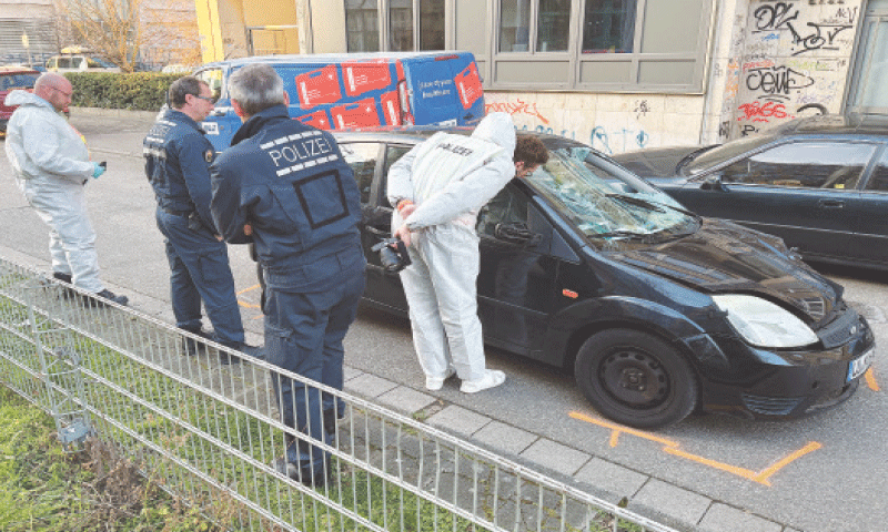 FORENSIC experts work on the car which drove into a crowd in Mannheim, Germany, on Monday.—Reuters FORENSIC experts work on the car which drove into a crowd in Mannheim, Germany, on Monday.—Reuters