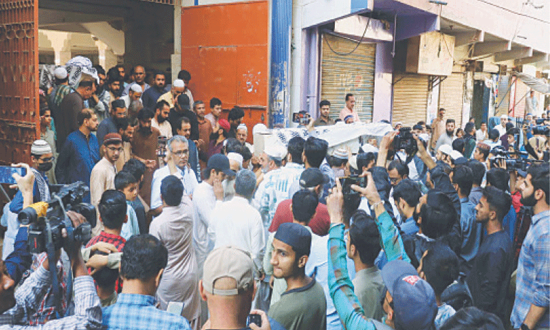 People attend the funeral of the slain family at a mosque in Shah Faisal Colony. —PPI