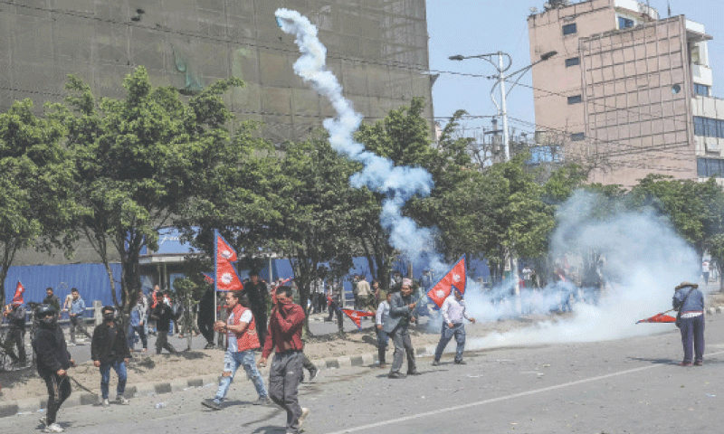 Pro-monarchy demonstrators pelt stones on police during a protest in Kathmandu to demand that Nepal be declared a Hindu state.—AFP Pro-monarchy demonstrators pelt stones on police during a protest in Kathmandu to demand that Nepal be declared a Hindu state.—AFP
