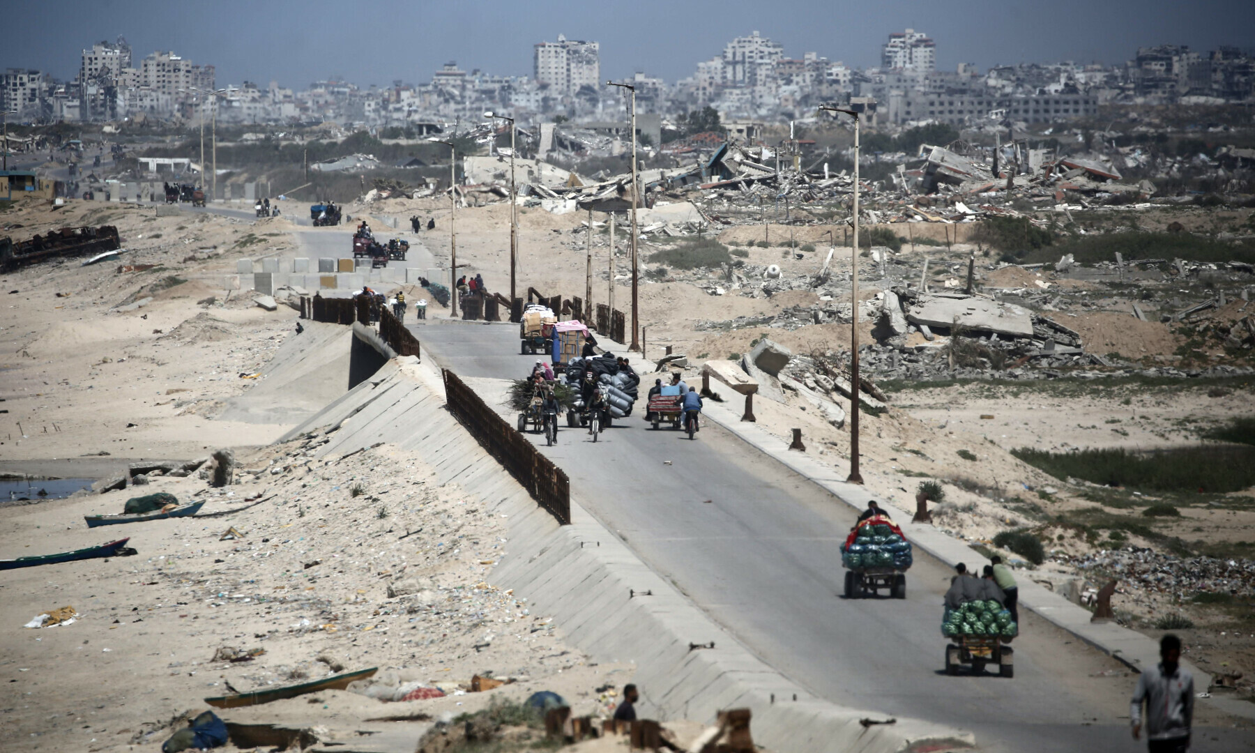 Palestinians transport goods along the coastal al-Rashid road, linking Gaza City in the north and Nusseirat in the central part of the Palestinian territory on April 4, 2025. — AFP