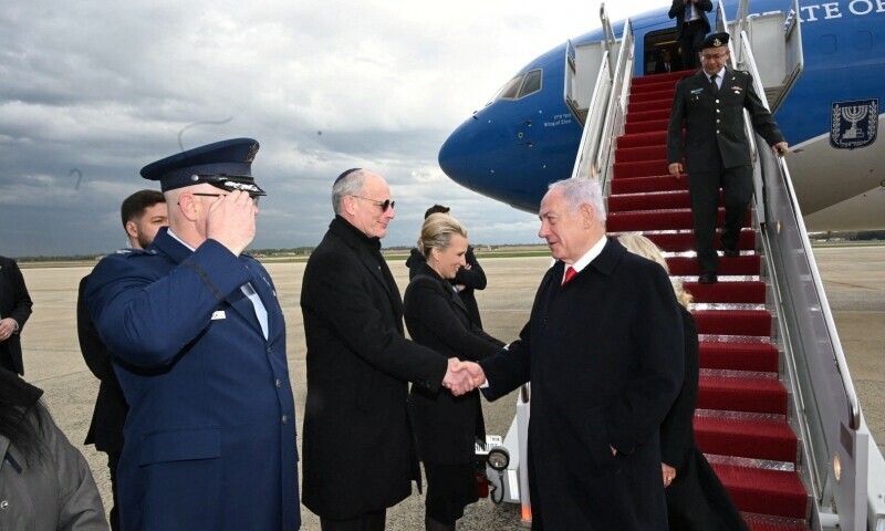 Israeli Prime Minister Benjamin Netanyahu and his wife Sara Netanyahu greet officials upon arrival at an airport in Washington DC, US — Reuters