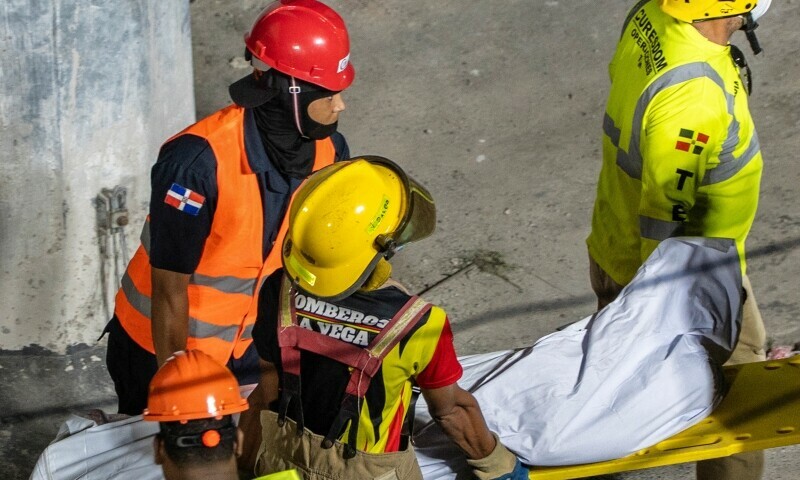 Rescue teams evacuate a body from the Jet Set nightclub following the collapse of its roof in Santo Domingo on April 8, 2025. — AFP
