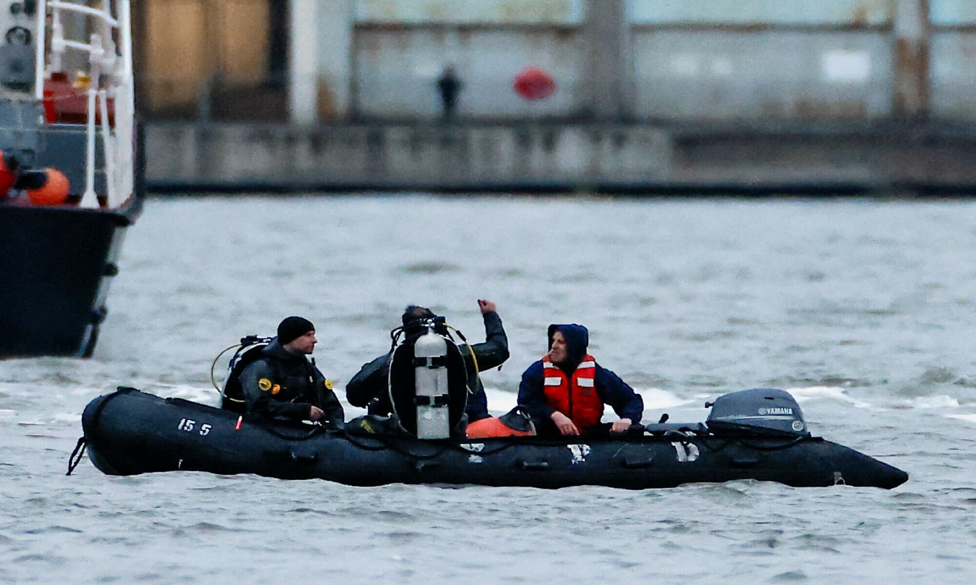 Emergency personnel work at the scene of a helicopter crash on the Hudson River near lower Manhattan in New York, as seen from Newport, New Jersey in the US on April 10, 2025. &mdash; Reuters